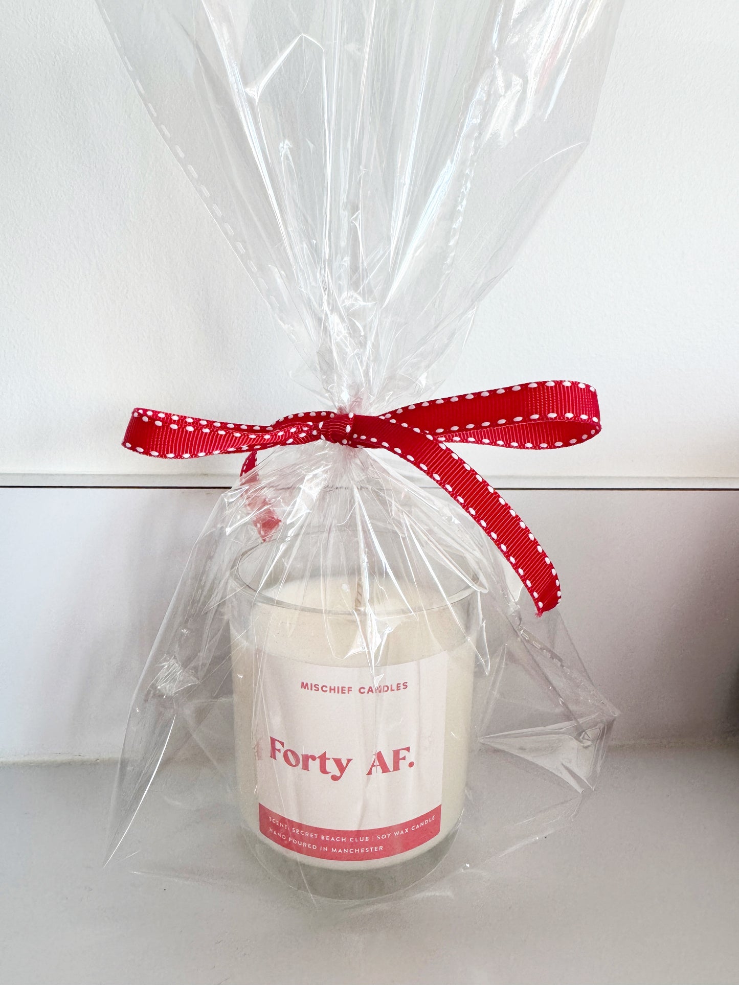 Assorted cello wrapped Mischief Candles with no box